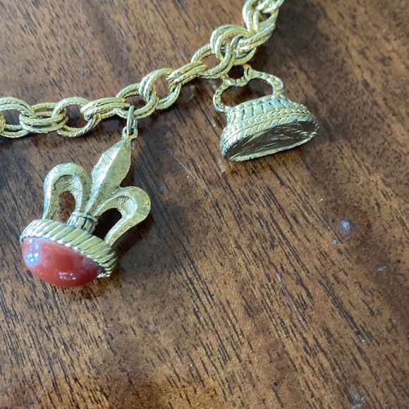 Gold tone charm necklace. Adjustable length. Great condition. - Picture 6 of 10